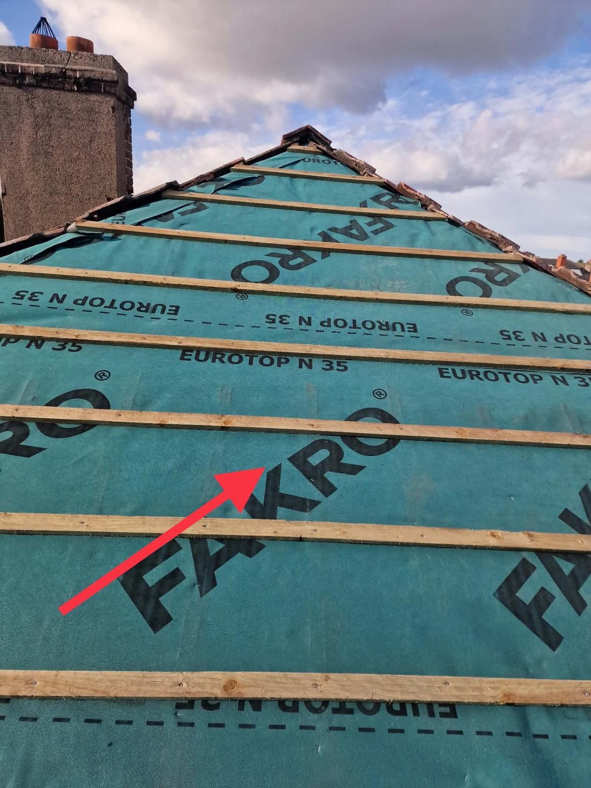 Breathable membrane and new battens running up to the ridge beside a chimney in Ballsbridge, Dublin 4