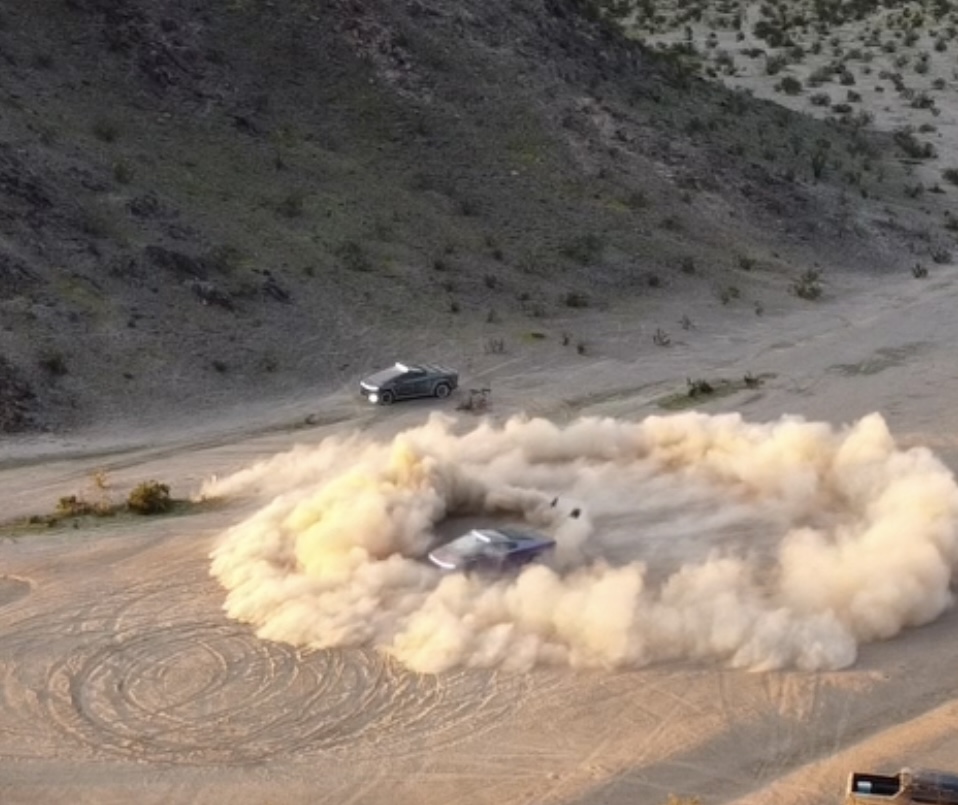 Cybertruck driving through desert dust