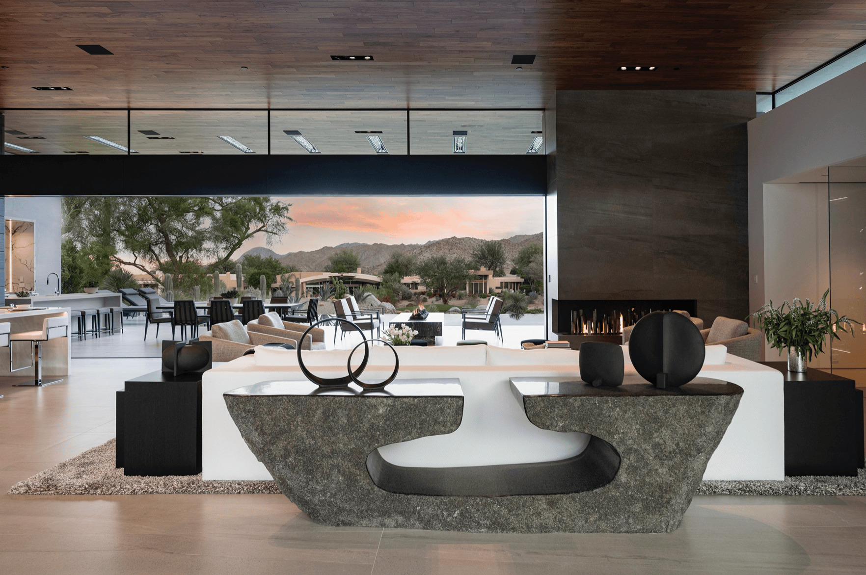 Modern indoor and outdoor living space with premium finishes by Evolution Dream Builders