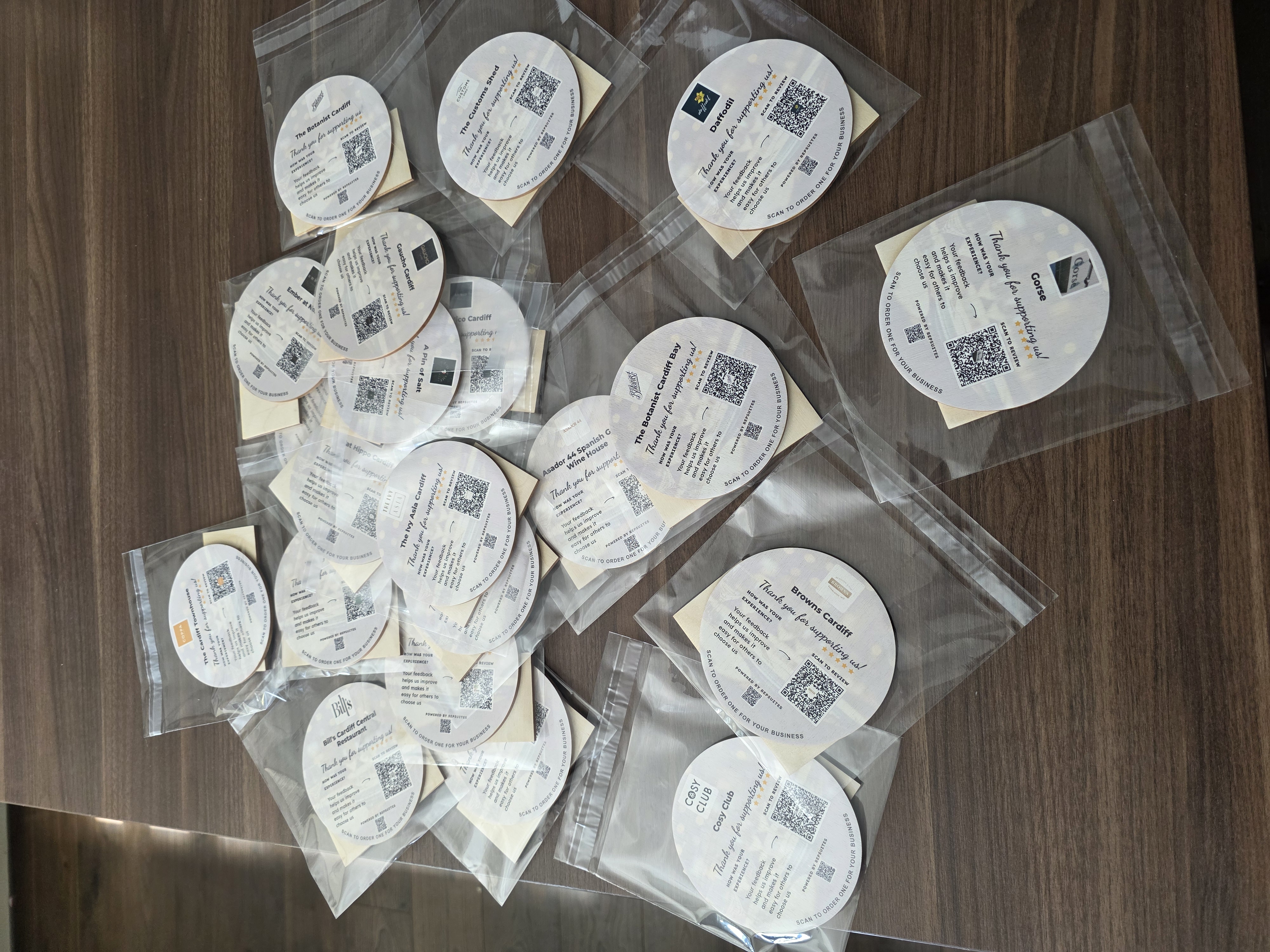 Custom branded coasters for multiple businesses
