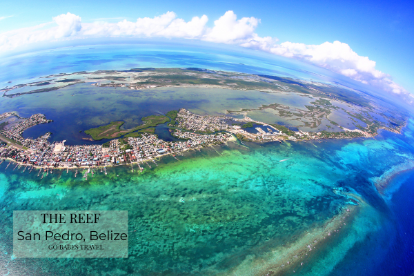 Aerial view of San Pedro on Ambergris Caye surrounded by turquoise Caribbean water and the Belize Barrier Reef