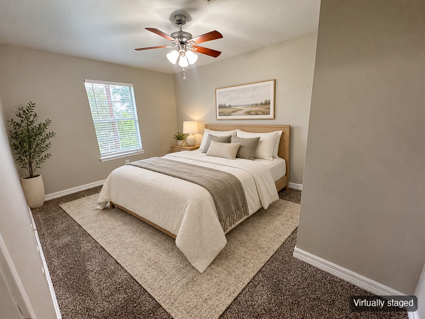 Bedroom with window and ceiling fan (virtually staged)