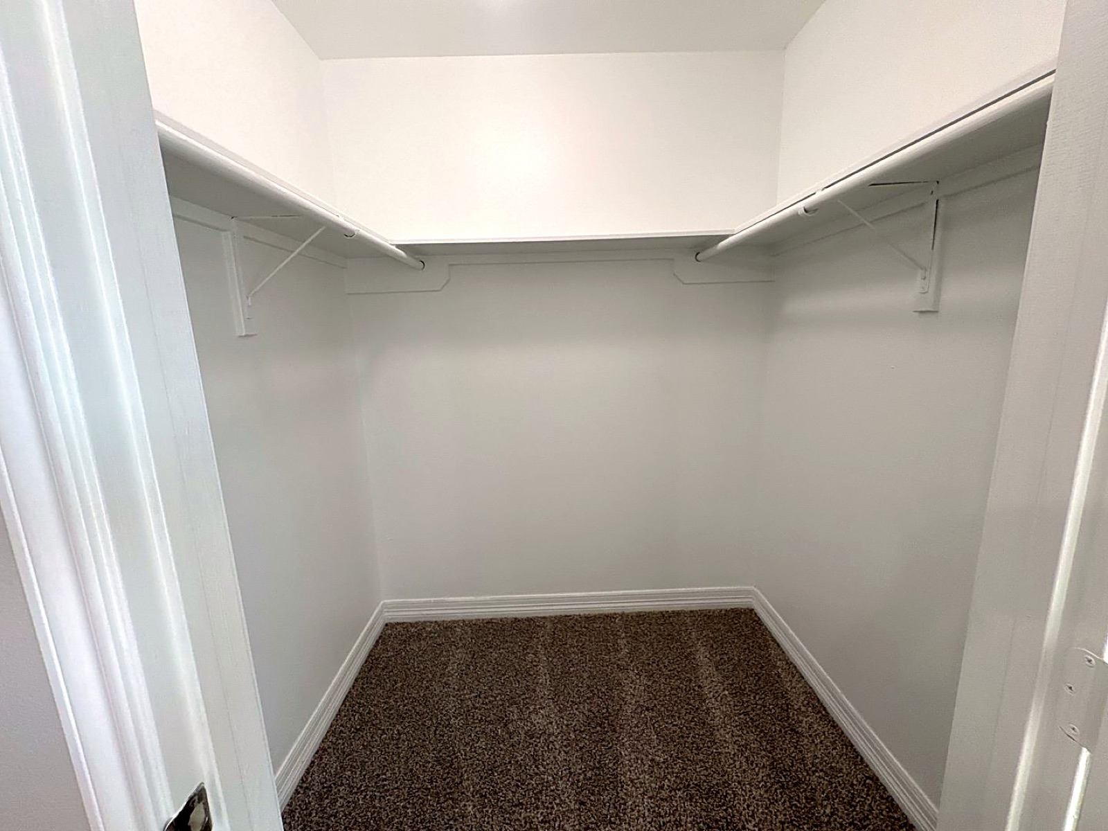 Empty walk-in closet with shelving in an apartment at Grace Pointe, Longview, TX
