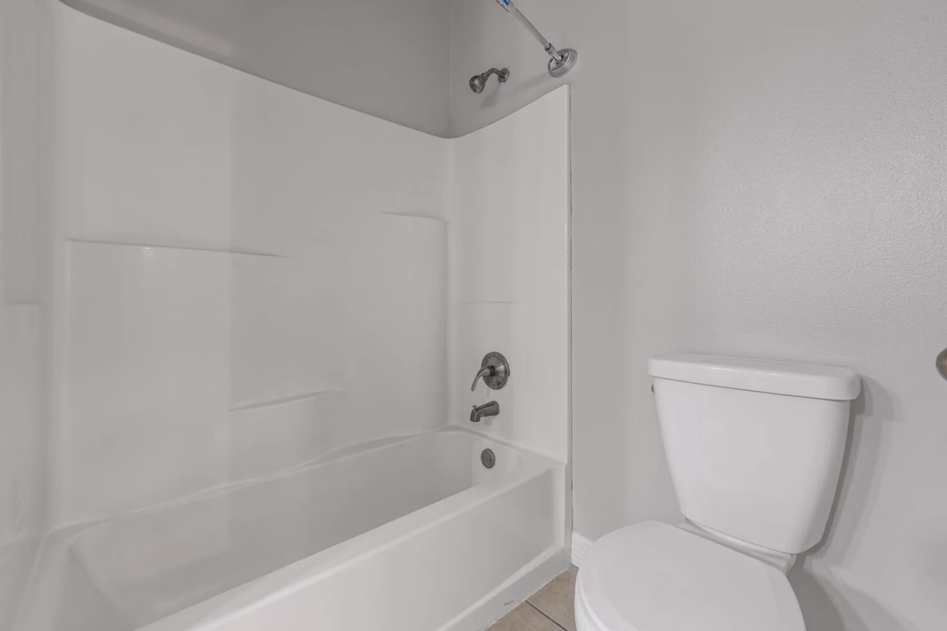 Bathroom with a tub and shower