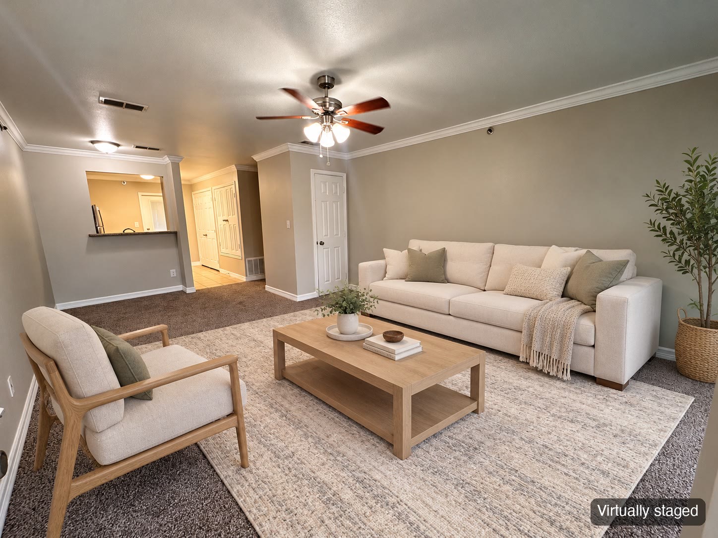 Living room with sofa and plants (virtually staged)