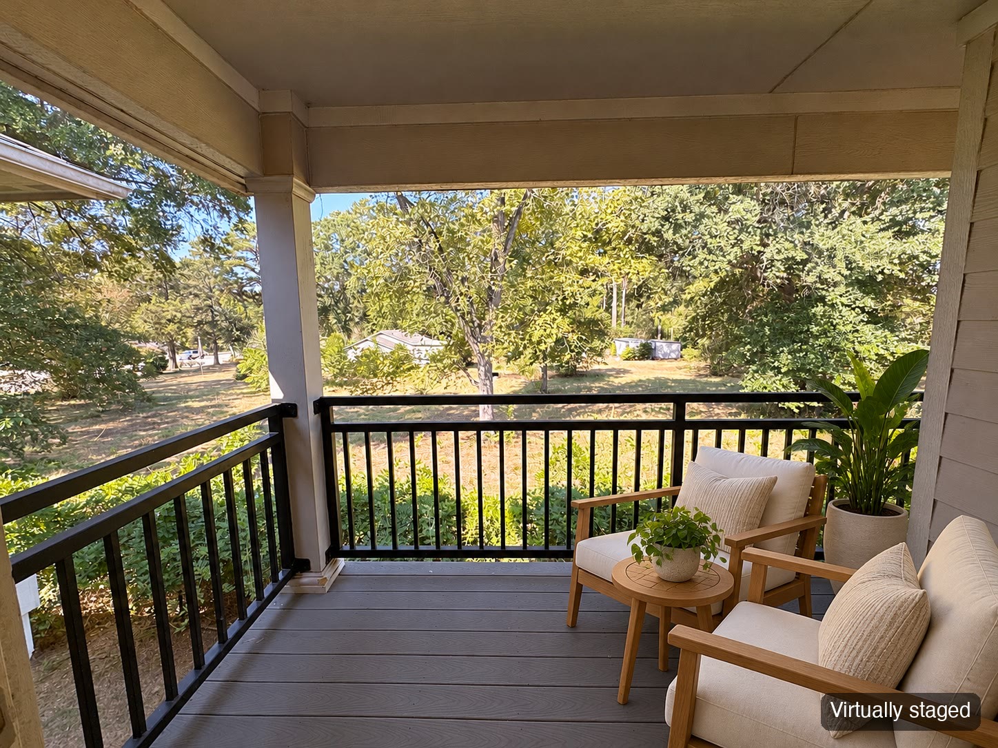 Covered balcony with outdoor seating (virtually staged)