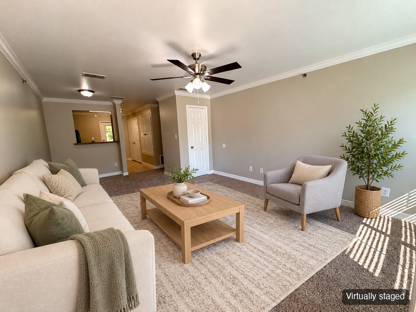 Living room with ceiling fan and carpet (virtually staged)