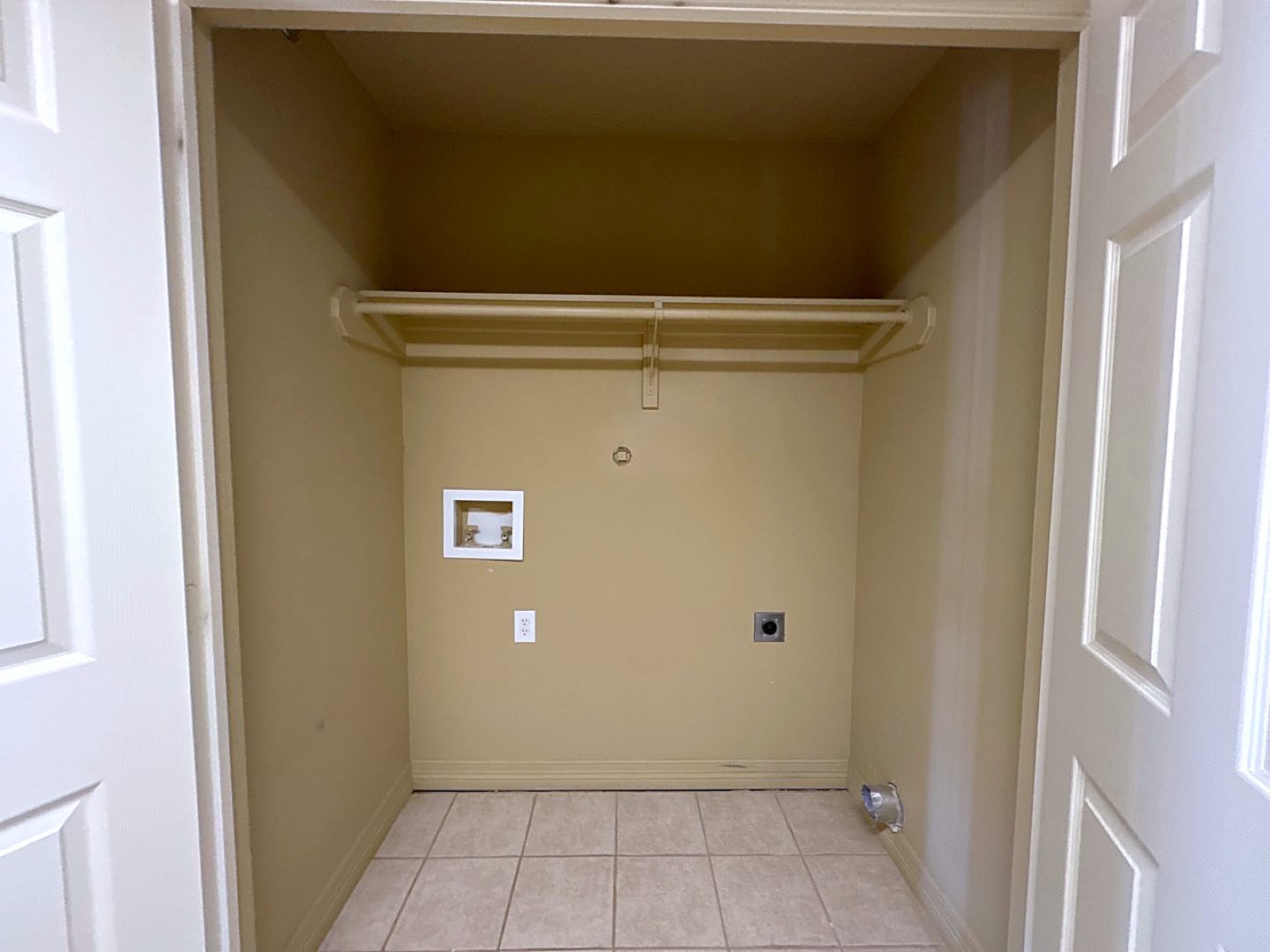 Laundry closet with washer and dryer hookups in an apartment at Grace Pointe, Longview, TX