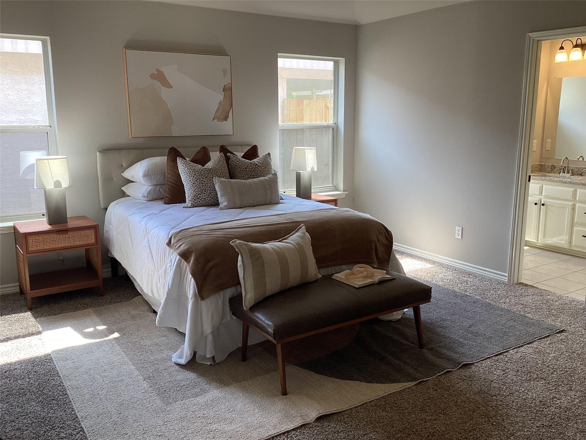 Primary bedroom in the previous listing photos — dim, warm cast, half the room cropped out of frame