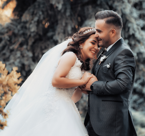 happy couple smiling and hugging a wedding