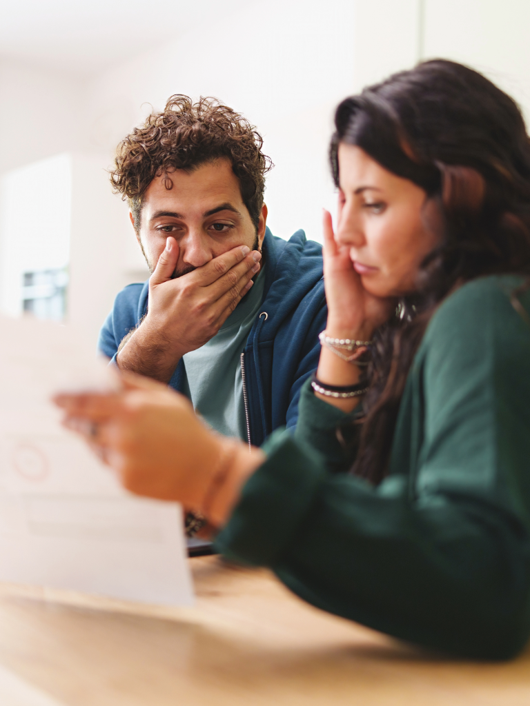 Homeowner opening a PG&E bill