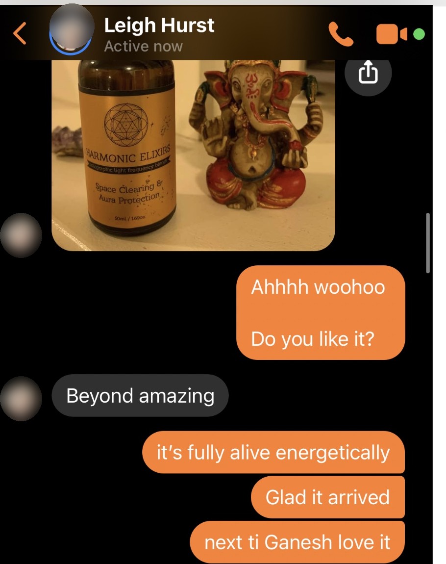 Leigh Hurst on Messenger with her Space Clearing elixir next to Ganesh