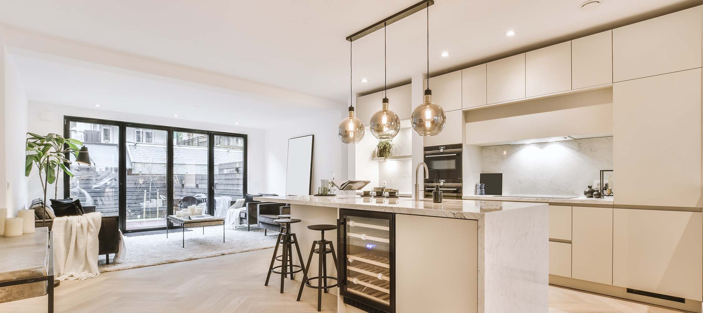 A sleek and sophisticated kitchen renovation by Interiors By Alanna in Kitchener-Waterloo, maximizing storage space and functionality for the homeowner's needs, creating a dream kitchen in your KW home.