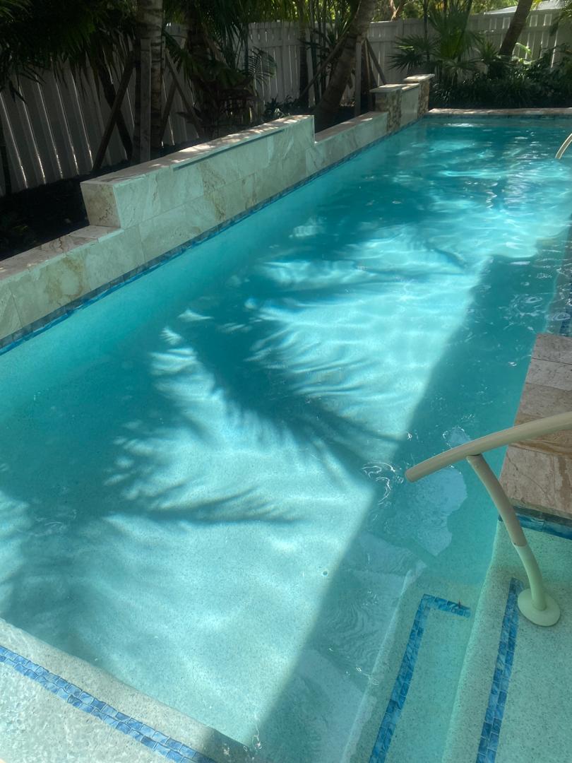 Crystal clear pool after hurricane cleanup by Triton Professional Pool Services in Sarasota FL