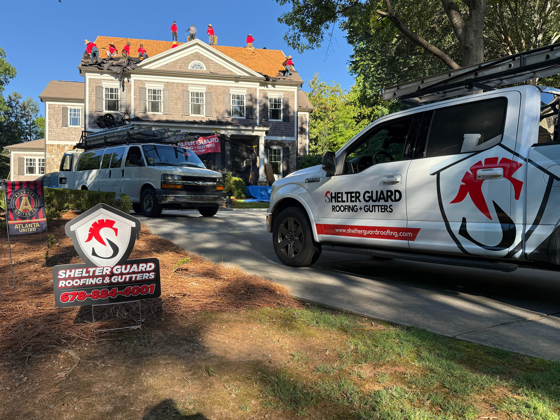 Shelter Guard truck and crew working on an asphalt shingle roof replacement in Marietta
