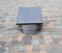 Solar attic fan on a colorful shingle roof