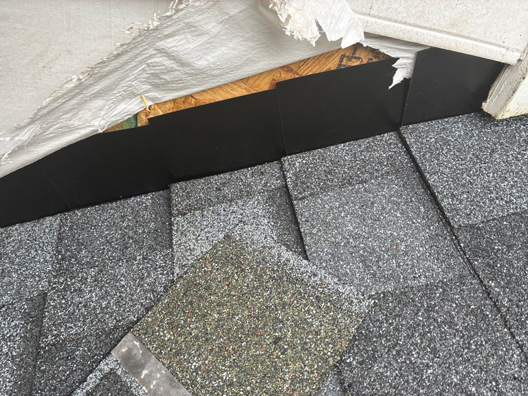Exposed roof flashing area during a repair inspection