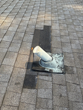 Ceiling stain below a bathroom vent pipe