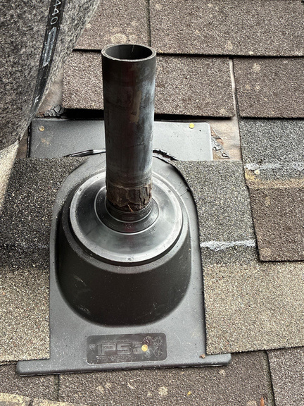 Cracked rubber pipe boot around a roof vent pipe