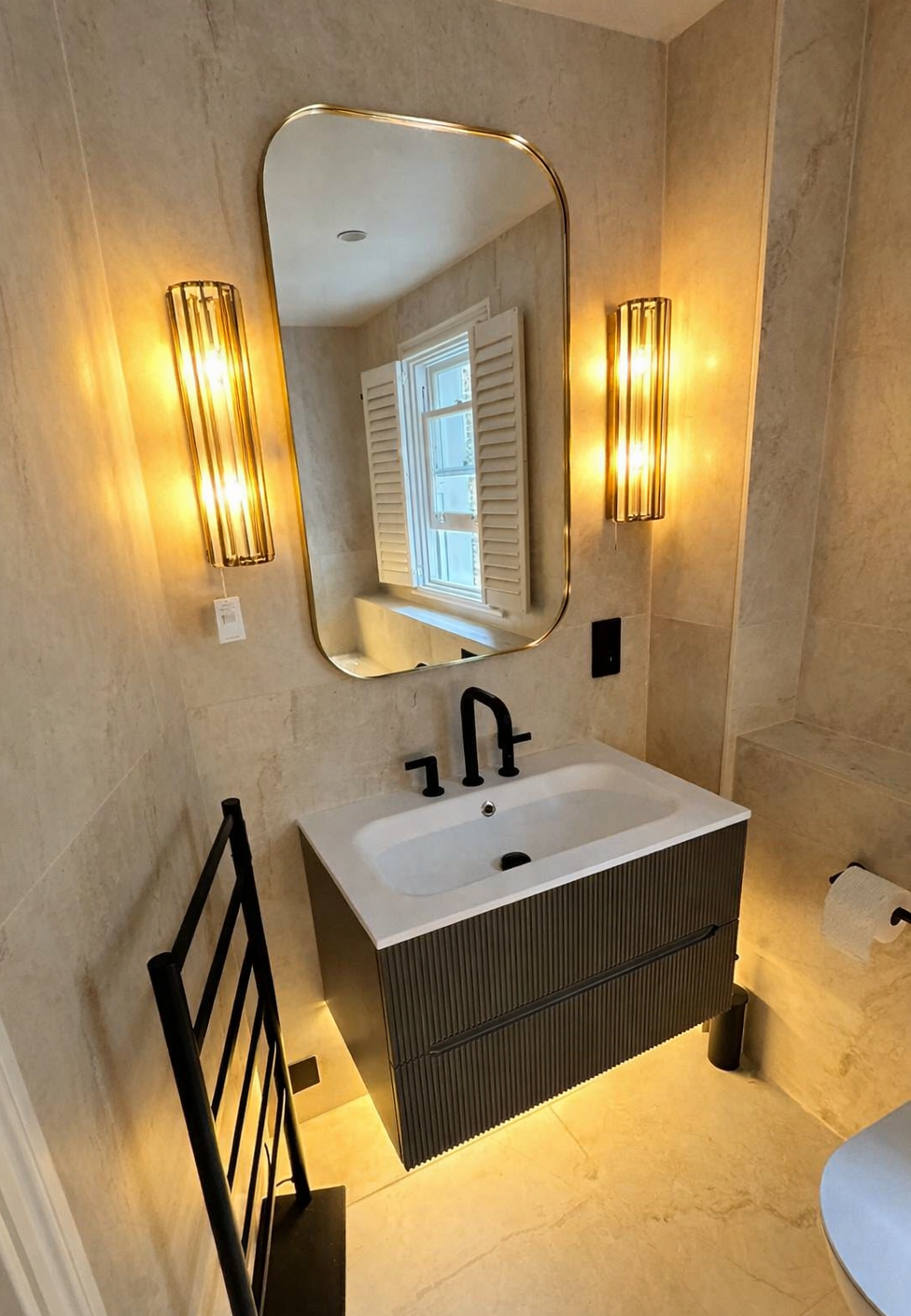 Small bathroom mirror lighting with soft layered illumination and a calm finish palette