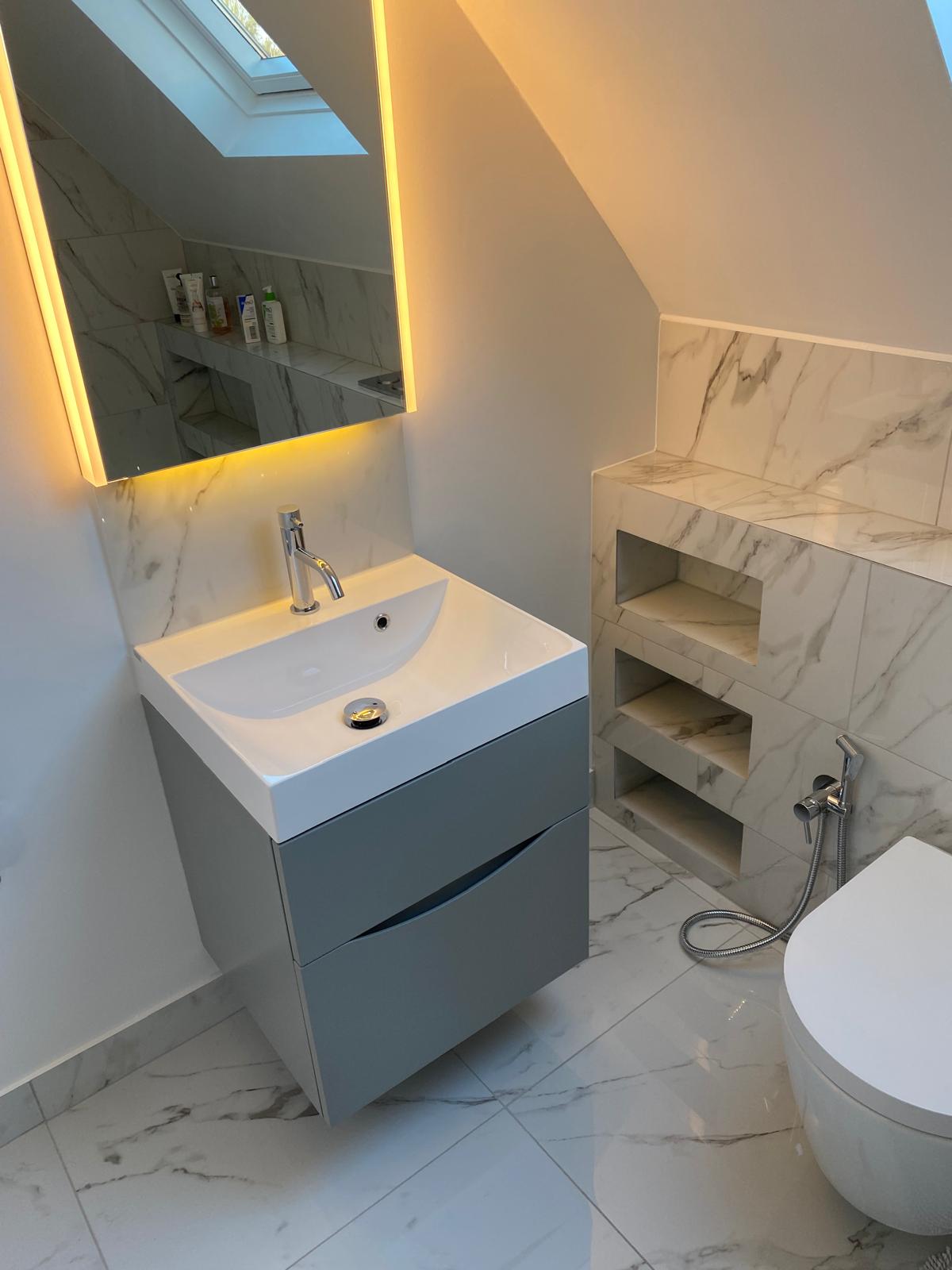 Small bathroom storage ideas with recessed shelving, compact vanity storage and integrated design details