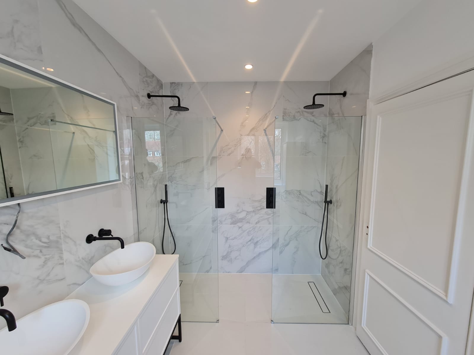 Compact bathroom layout with a shower and clear circulation space