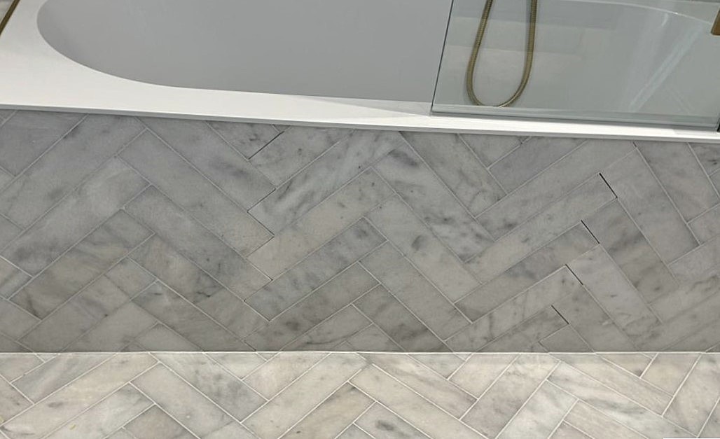 Bathroom tile and grout detail in a neutral palette