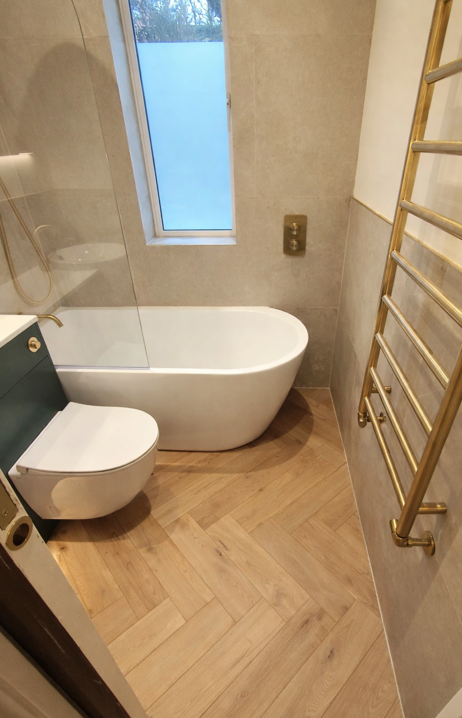 Small bathroom with coordinated wall and floor tile colours