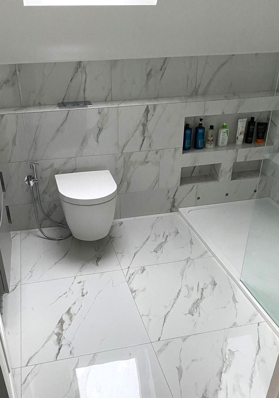 Warm beige bathroom tiles in a compact bathroom