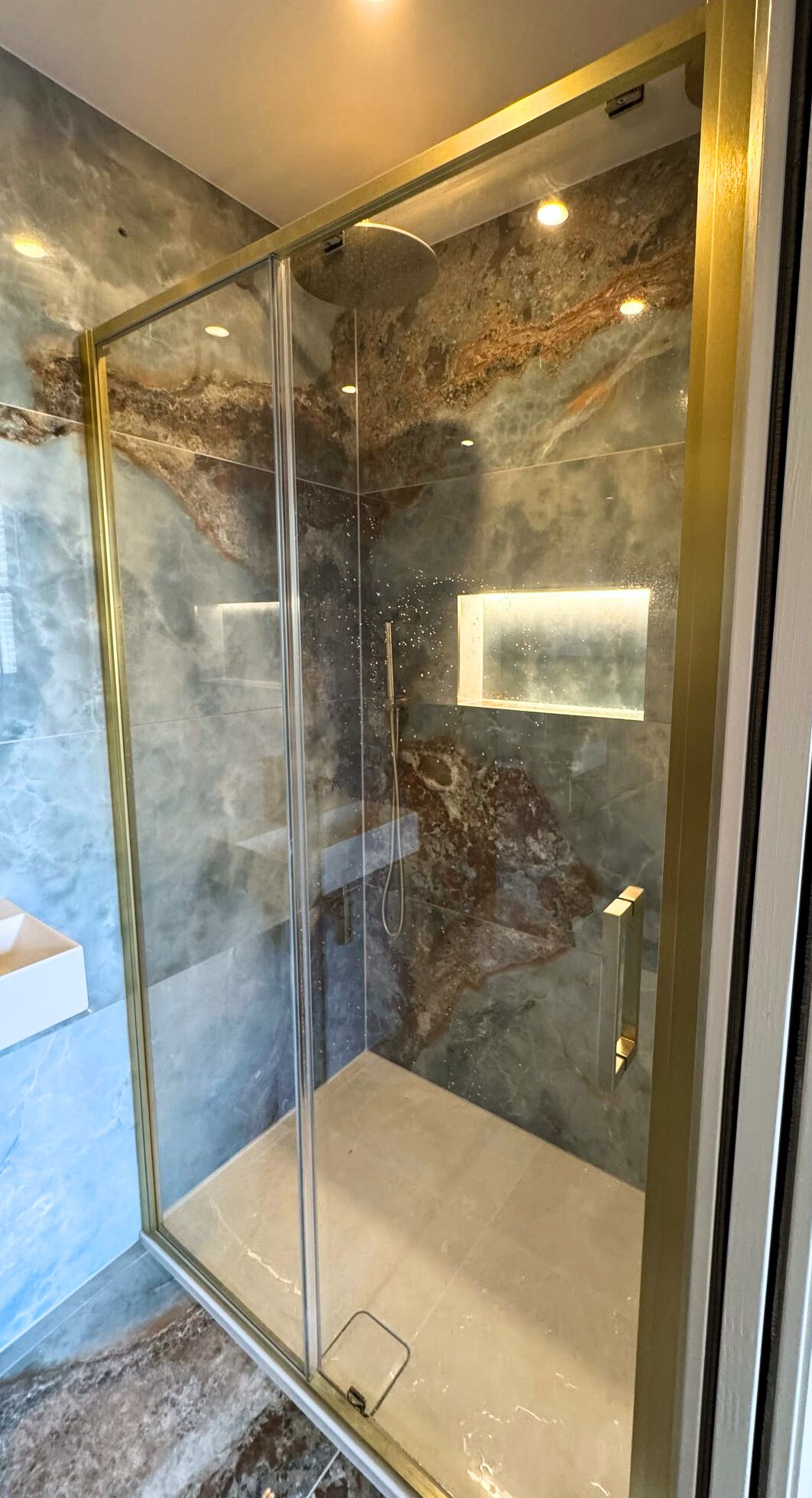 Shower area lighting in a calm bathroom design