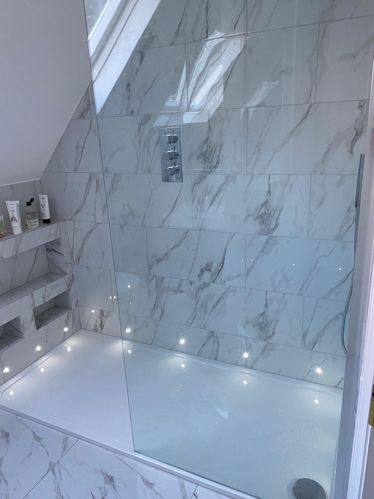 Wet room with open floor and integrated shower space
