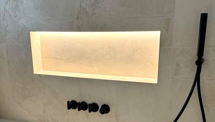 Shower niche detail with clean tile and grout alignment