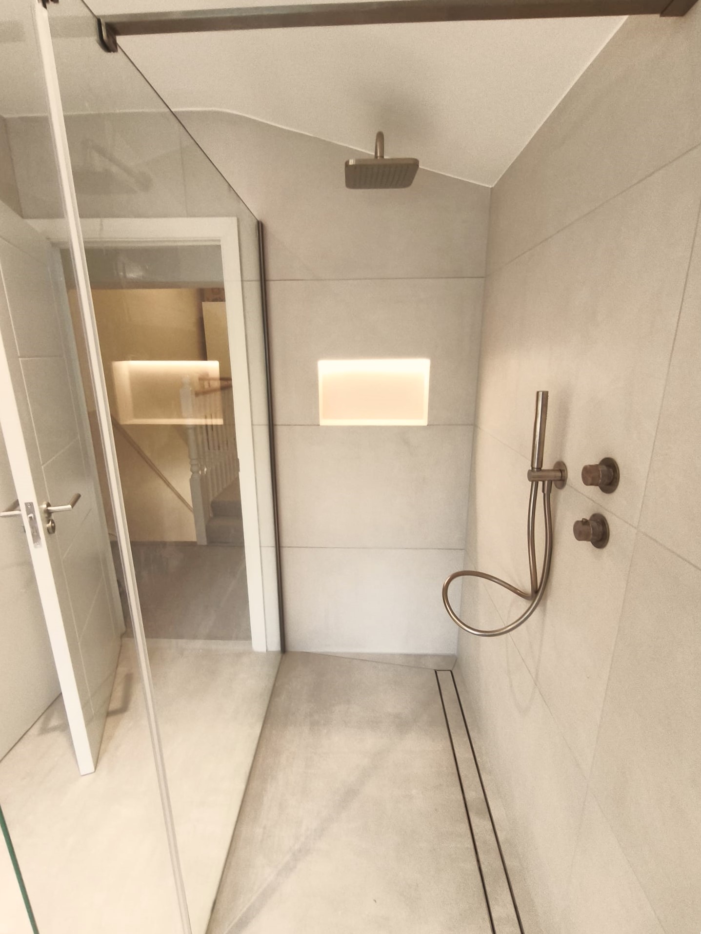 Premium shower with integrated storage detail
