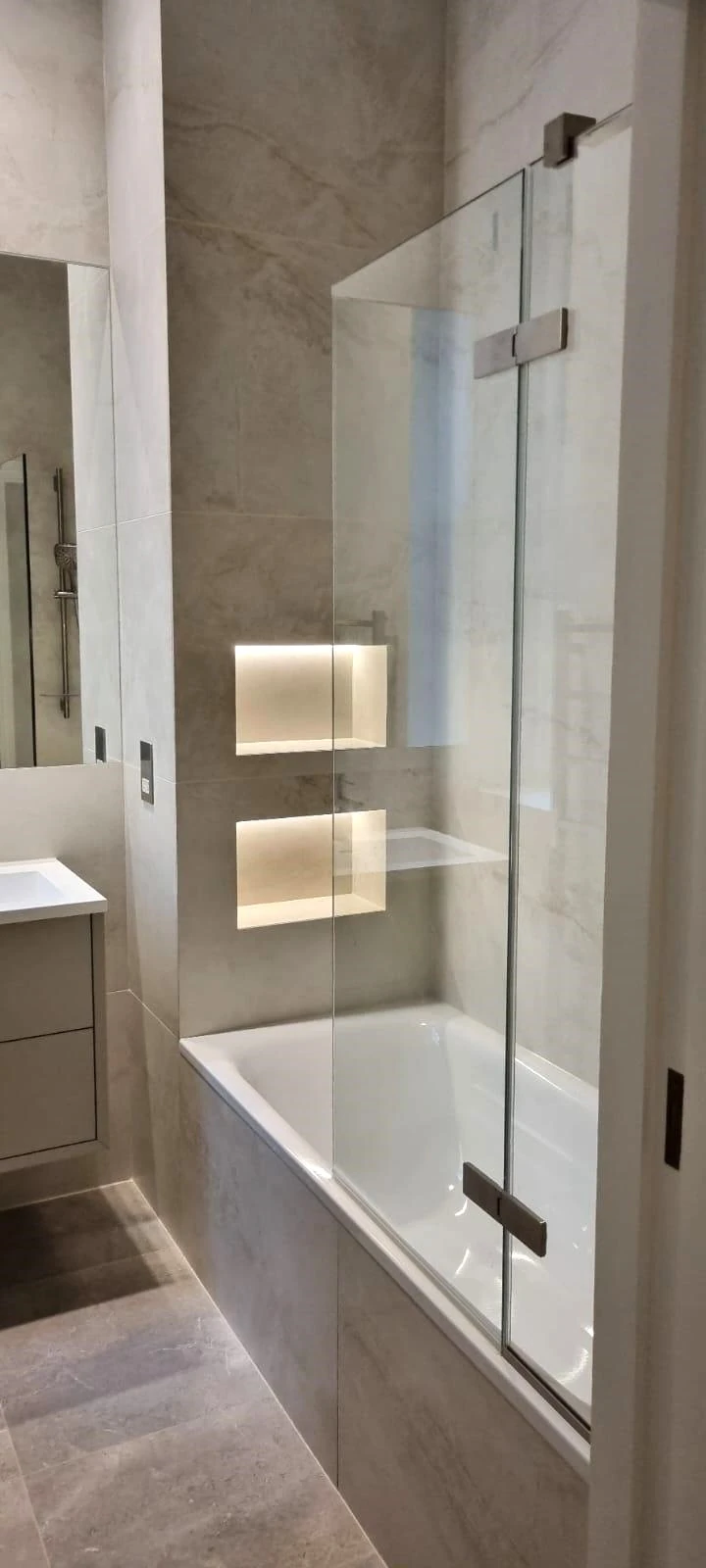 Integrated bathroom storage detail planned before tiling