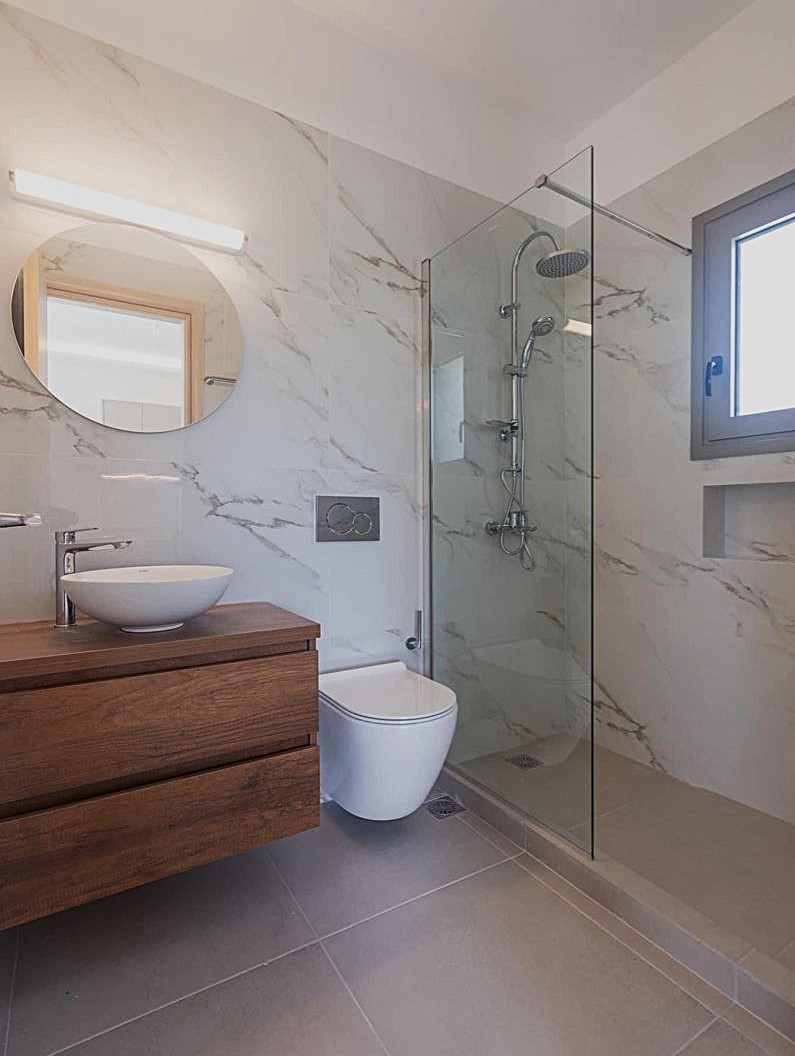 Bathroom with cohesive wall floor and shower tile strategy