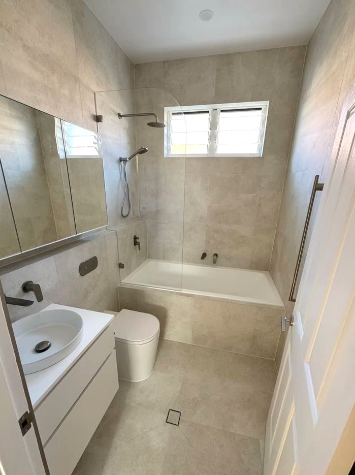 Compact bathroom with a bath that still works well in a small layout