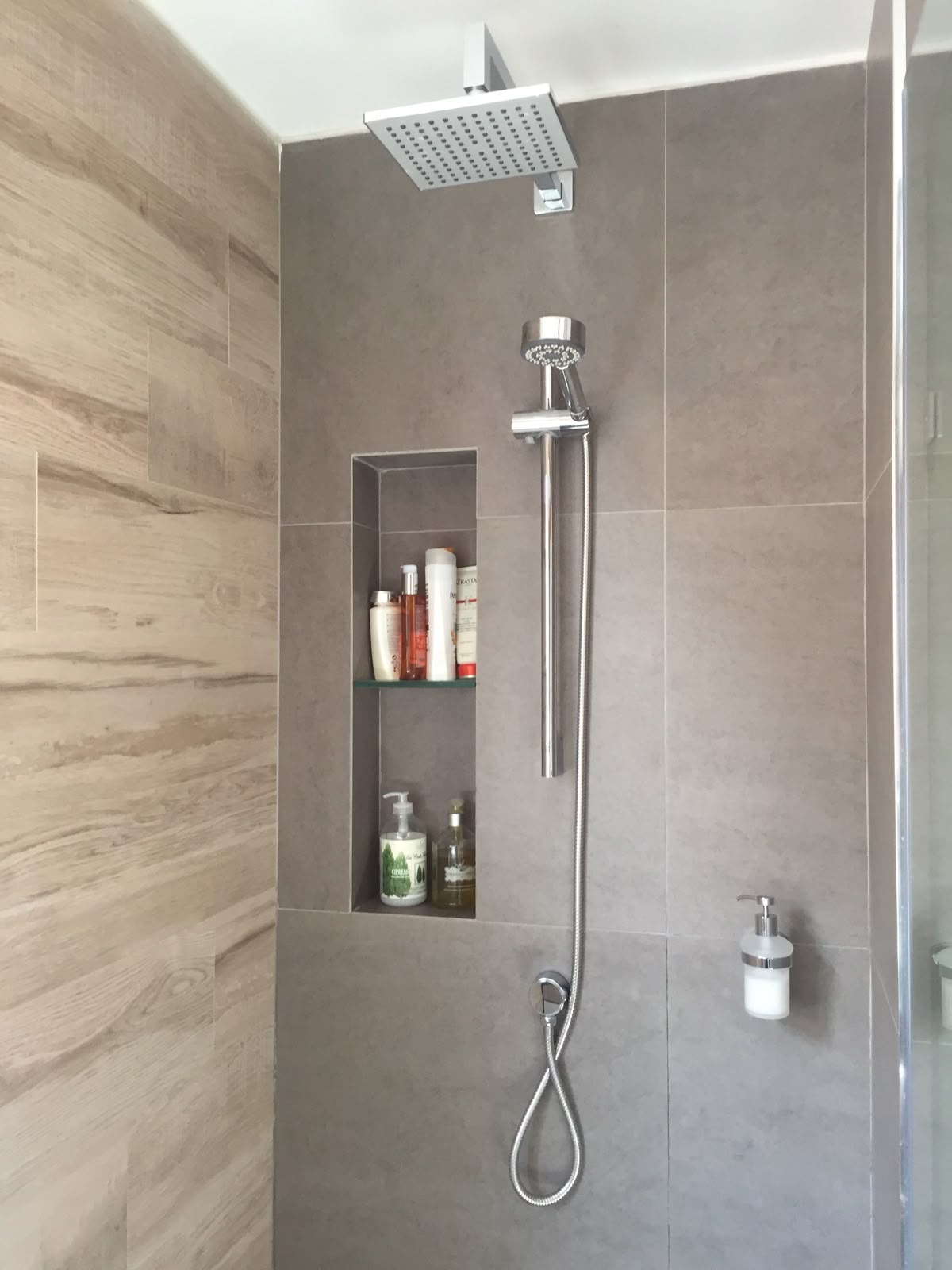 Built-in shower shelf placed at practical height