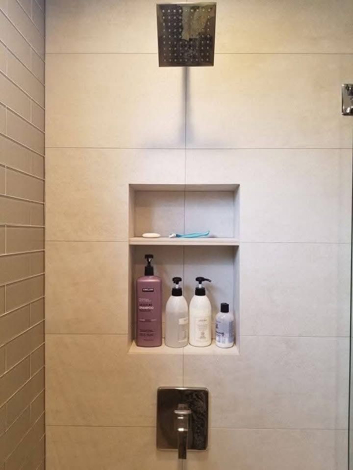 Everyday shower products stored on a built-in shelf