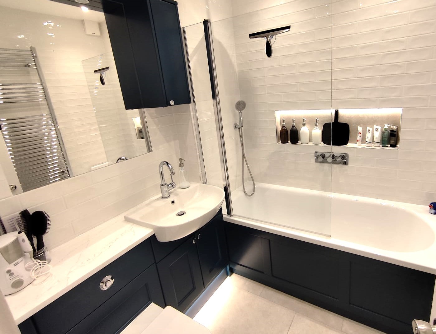 Small bathroom with integrated storage and calm layout