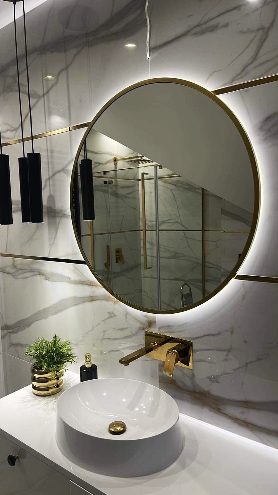 Backlit mirror in a modern bathroom vanity zone