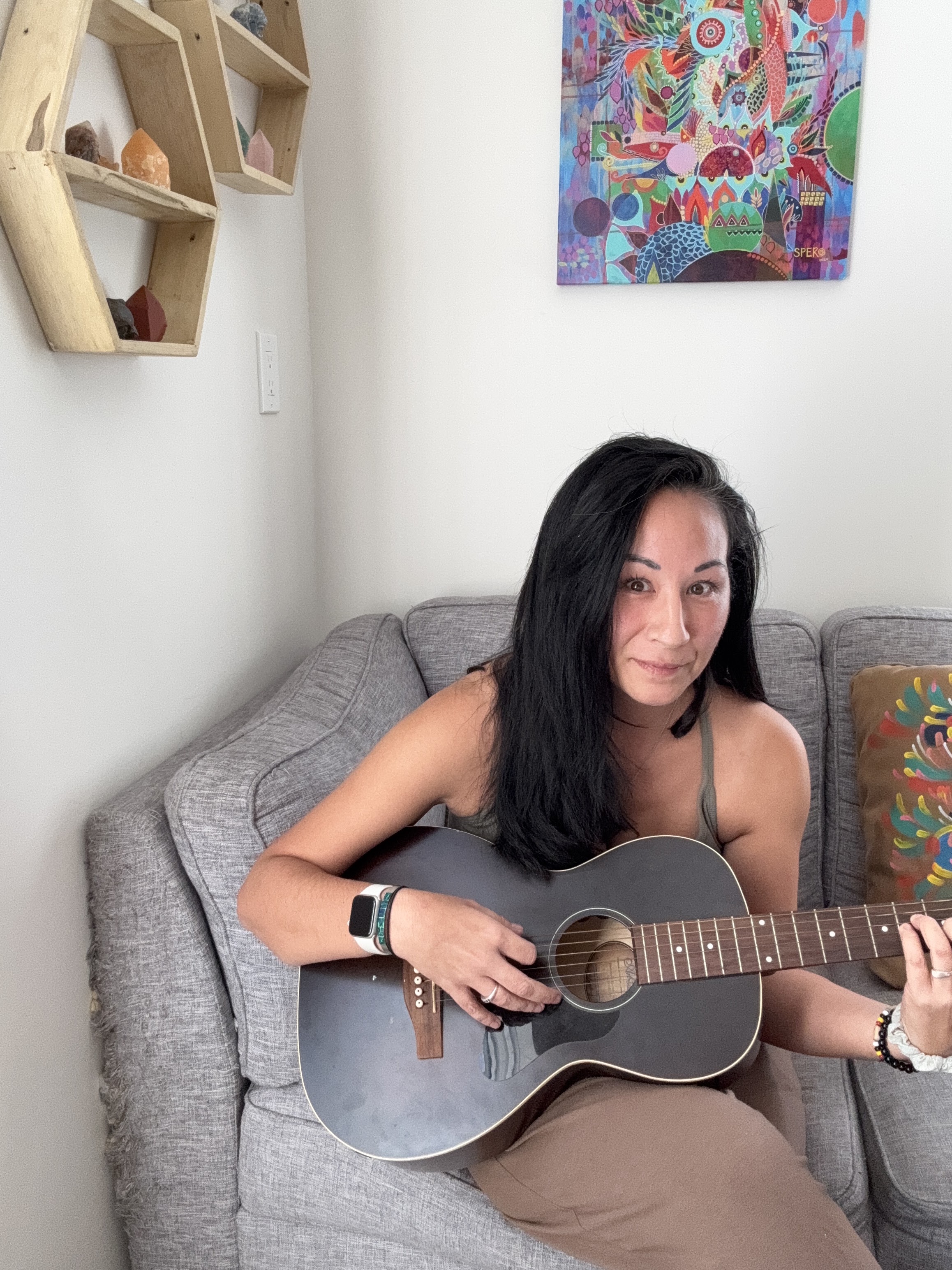 Monique playing guitar