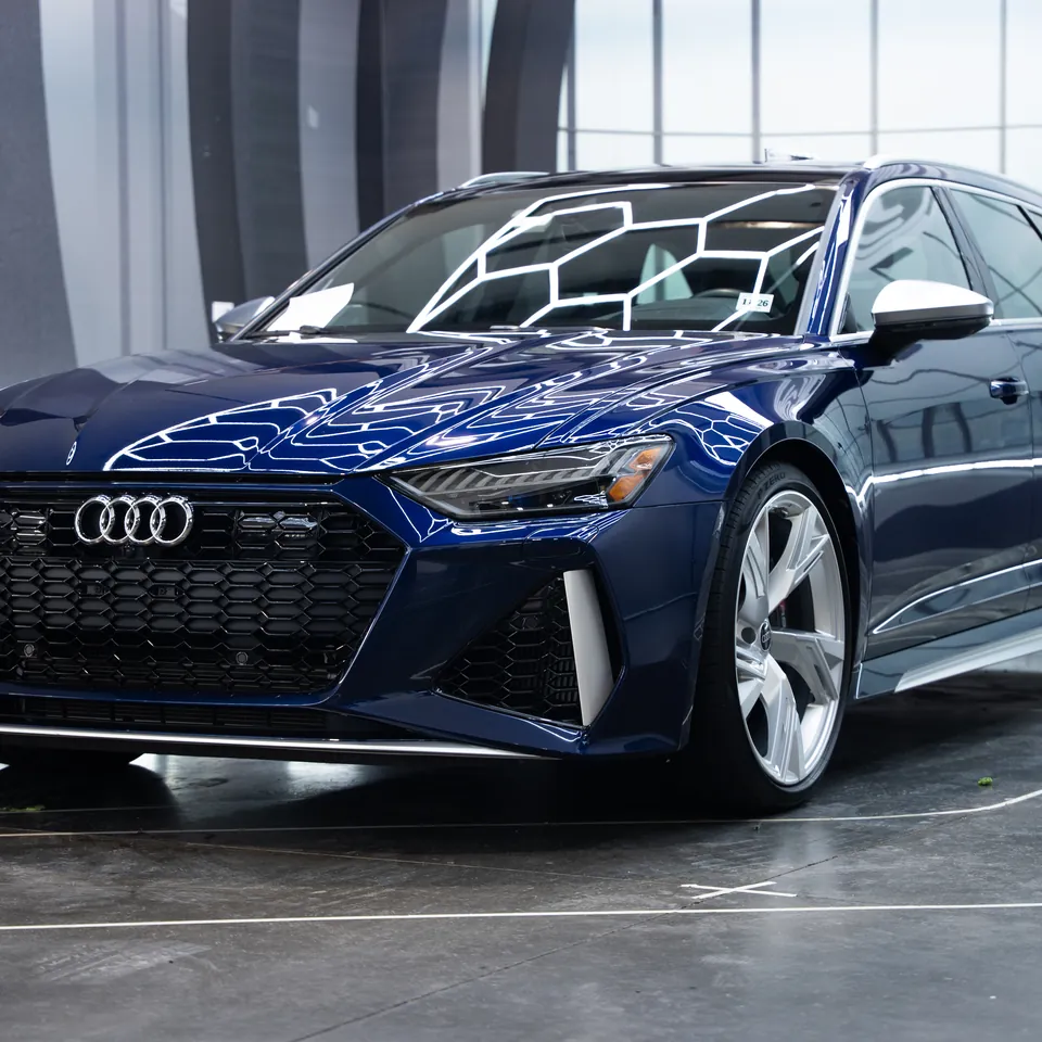 Blue Audi RS6 Avant under the hexagonal lights