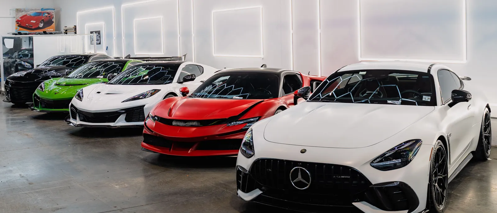 Clients’ cars lined up under the hexagonal light ceiling