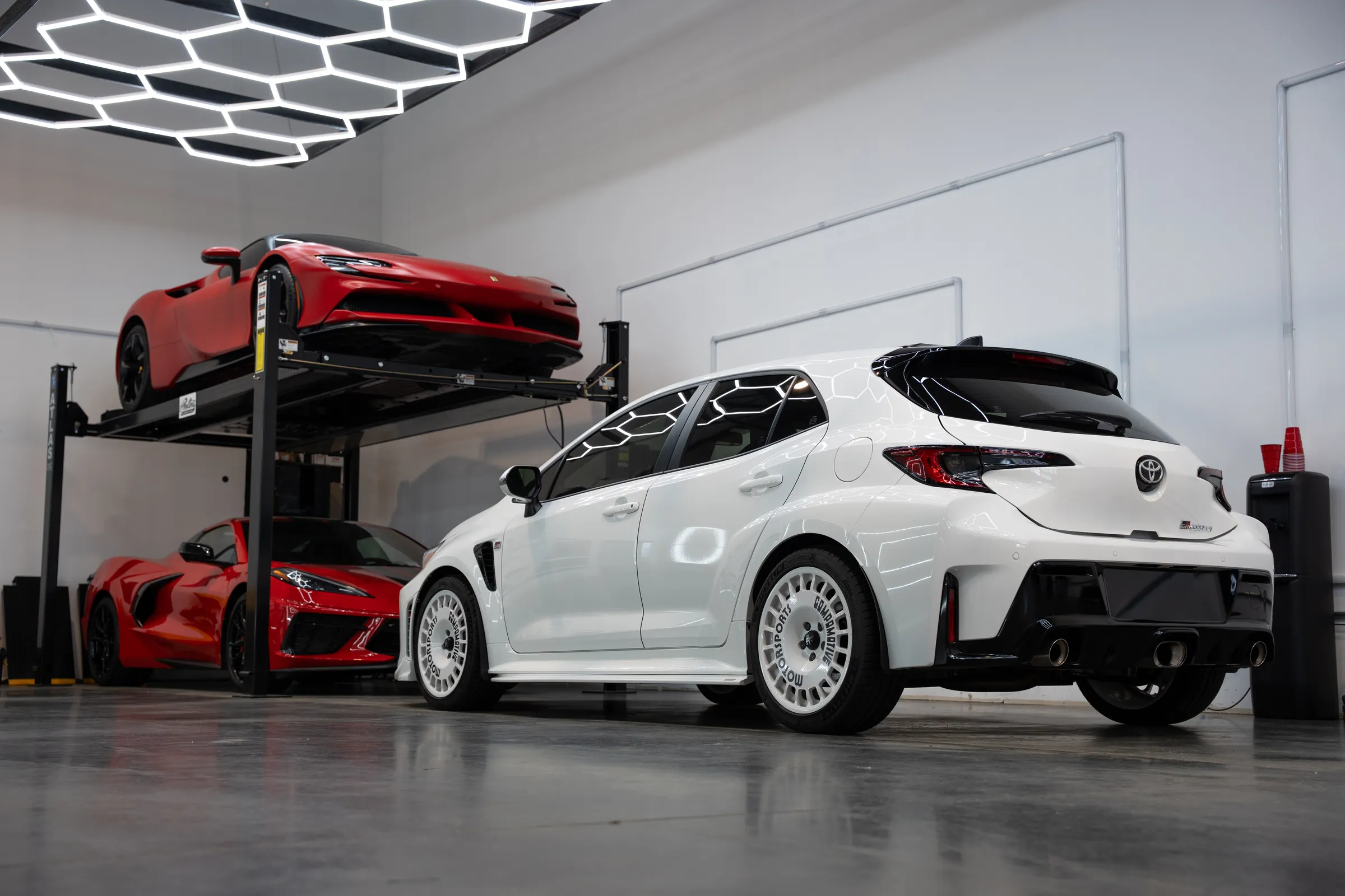 Indoor storage with cars on lifts in the Peotter building