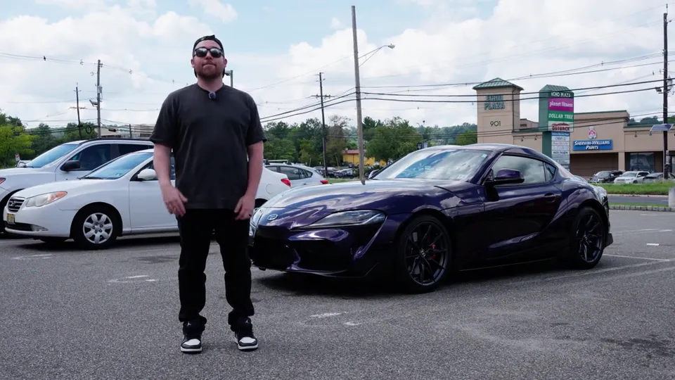 James next to his Toyota Supra in Obsidian Purple film