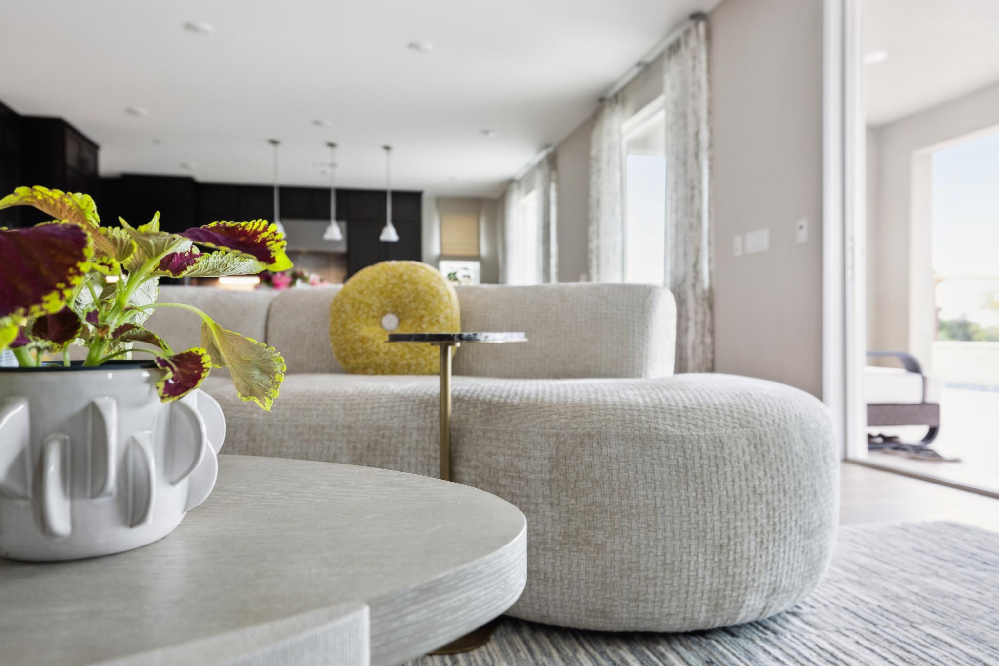 Great room with floor-to-ceiling windows and layered seating arrangement
