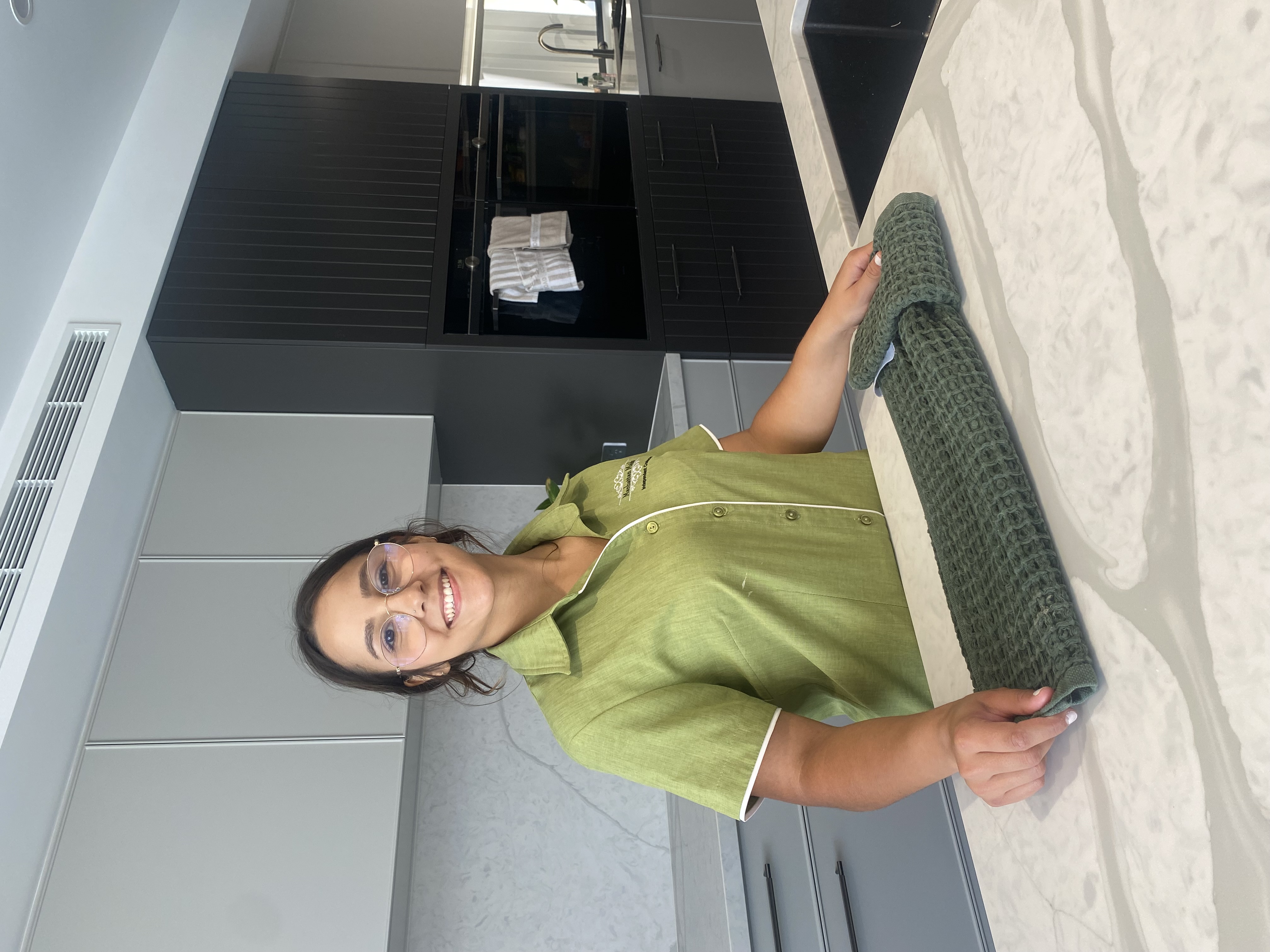 Manhattan Maids professional housekeeper in a modern kitchen