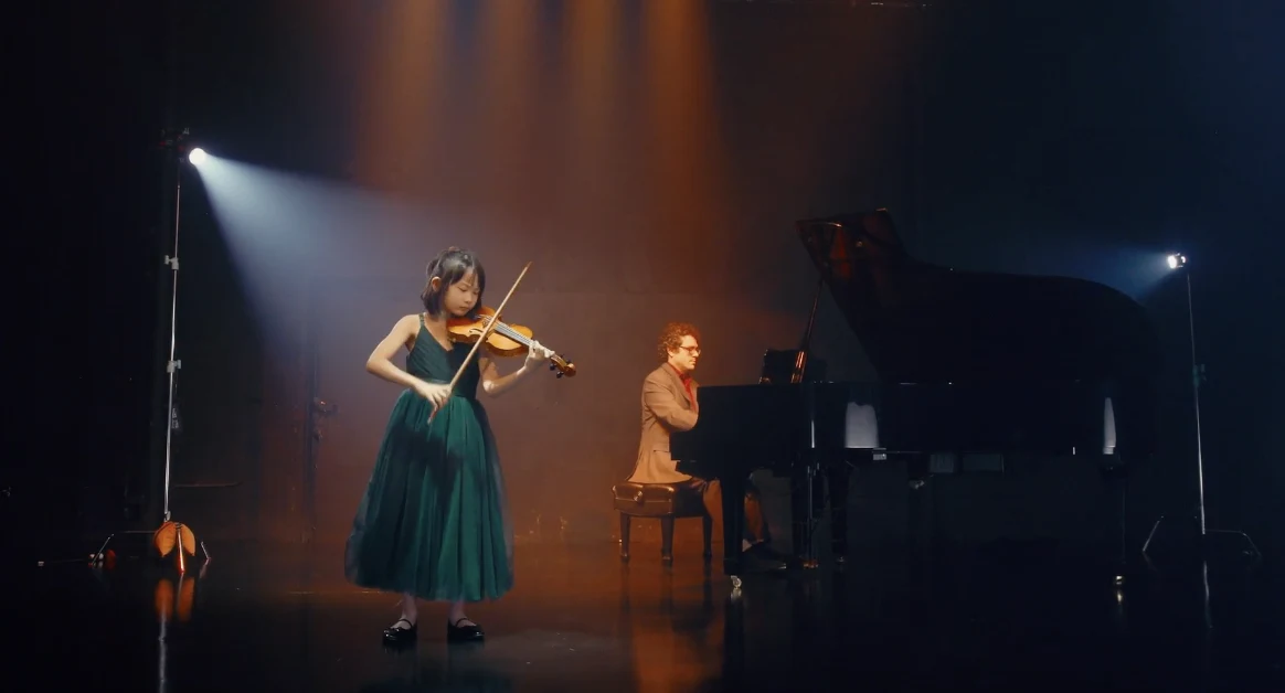 Violin and piano duet performed on stage