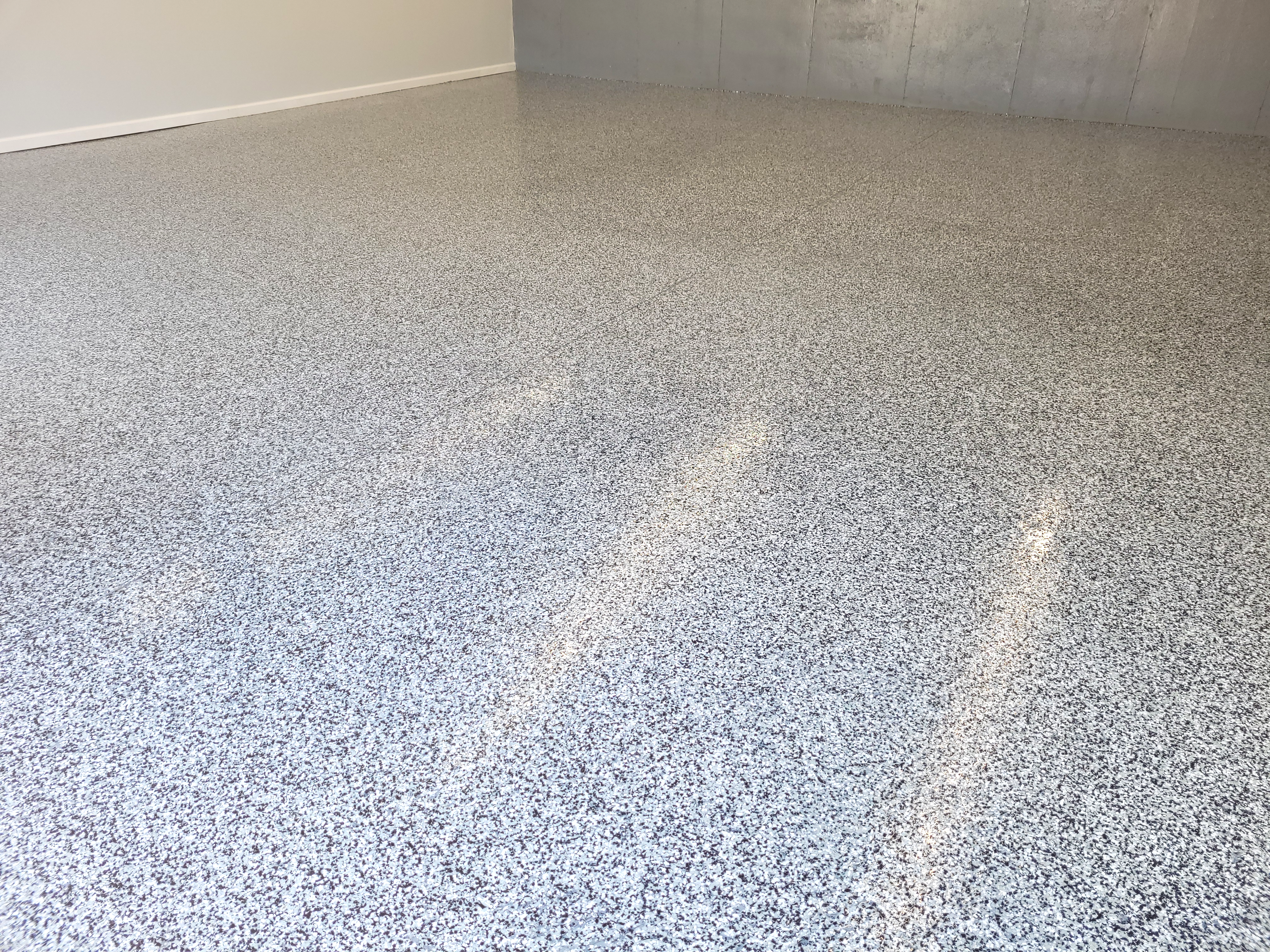 Finished basement epoxy and decorative concrete floor in Mason OH