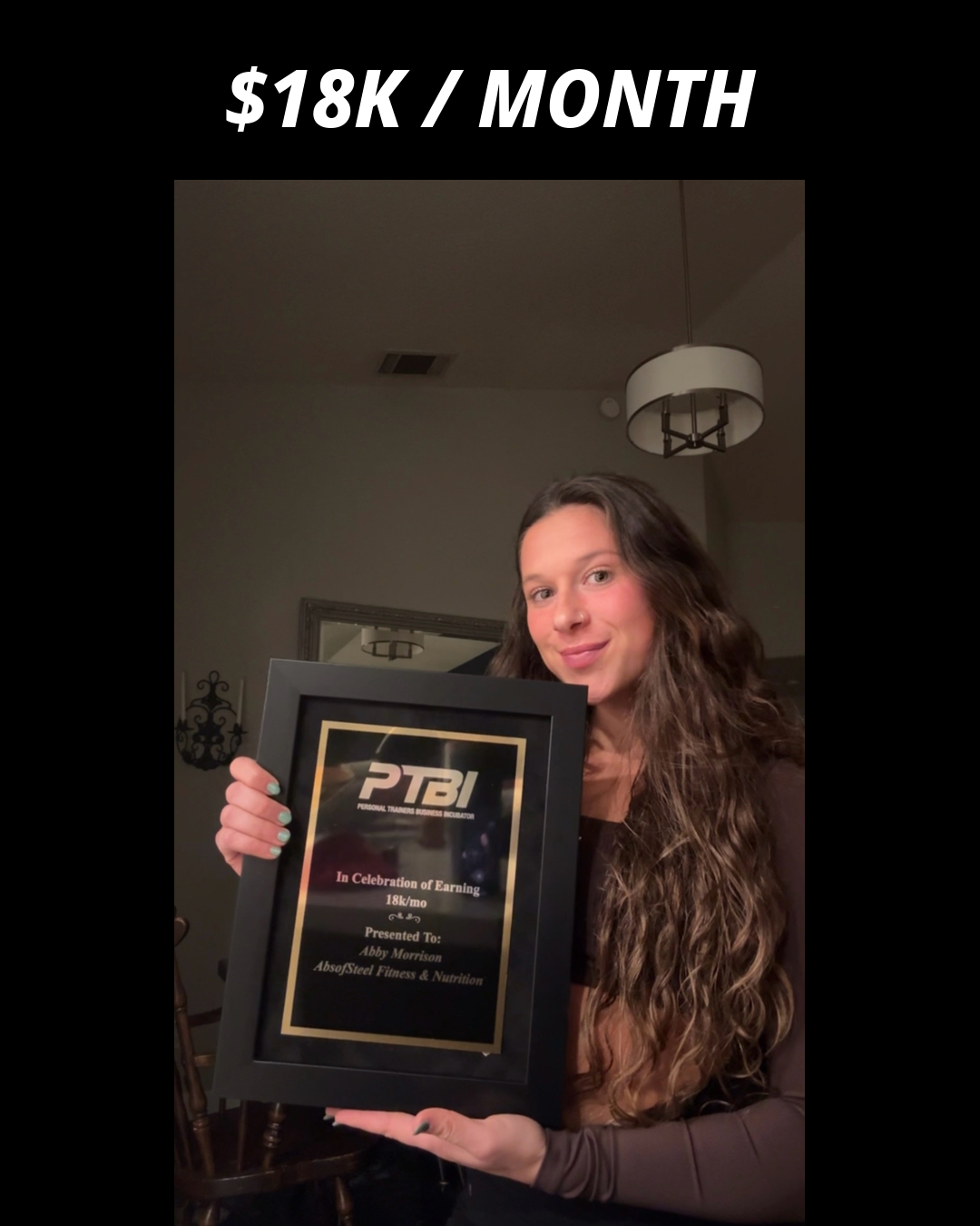 Abby Morrison holding her PTBI win plaque